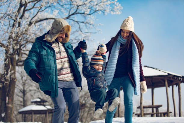 istock Family enjoying winter walk in the forest. 861261178