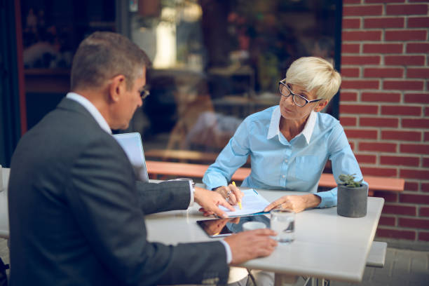 istock Mature business people collaborating after work 861272102