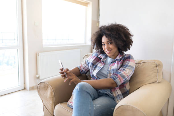 istock Woman using smart phone at home 861272712