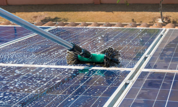 istock Cleaning solar panels on house roof 861275510