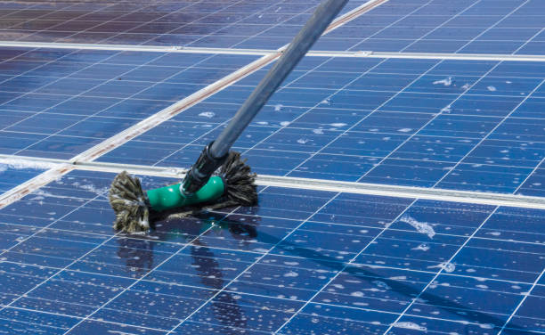 istock Cleaning solar panels on house roof 861275532