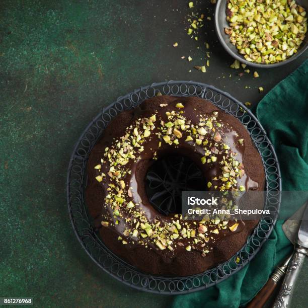 Chocolate Bundt Cake With Chocolate Glaze And Pistachios Stock Photo - Download Image Now