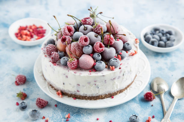 istock vanilla ice cream cake with frozen berries 861277312