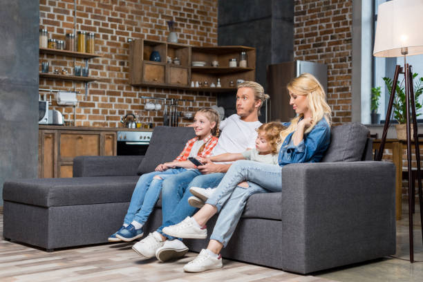 istock family watching tv 861282554
