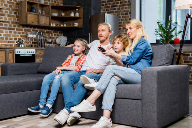istock family watching tv 861282814