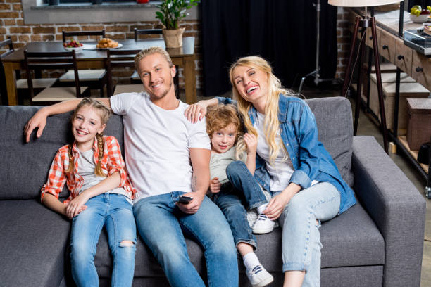 istock family watching tv 861282952