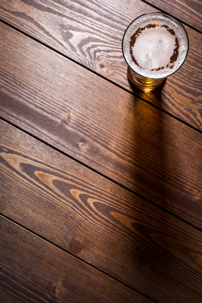 istock Beer glass on wooden table 861283362