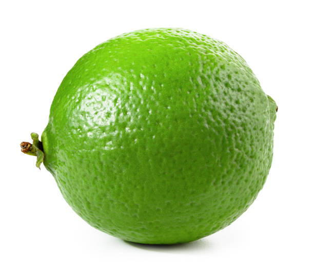 lima aislado en blanco - limones verdes fotografías e imágenes de stock