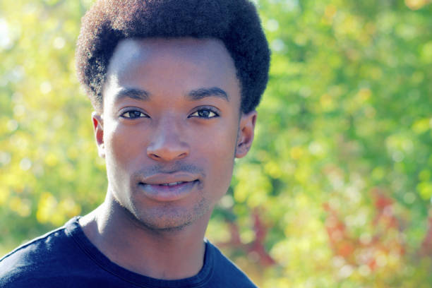 istock young man portrait outside summer against light 861293036