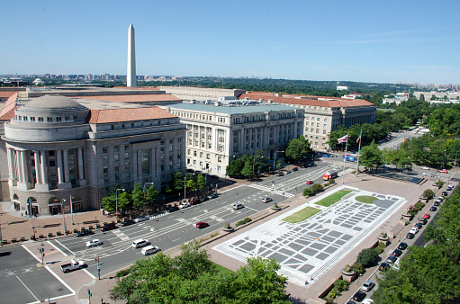 Freedom Plaza seen from the roof of the Warren Theater building, 12th and Pennsylvania Ave, NW, Washington, DC. From left to right are Ronald Reagan Building, District Building, Department of Commerce. Washington Monument is in background.