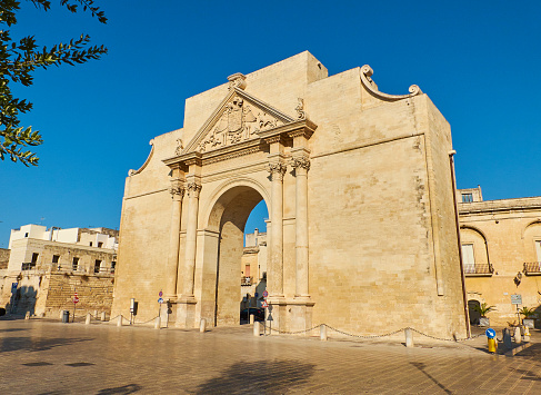 Porta Napoli gate in Piazzetta Arco di Trionfo square of Lecce. Puglia, Italy.