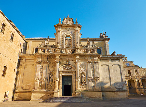 Principal facade of Cattedrale metropolitana di Santa Maria Assunta cathedral in Piazza del Duomo square of Lecce. Puglia, Italy.