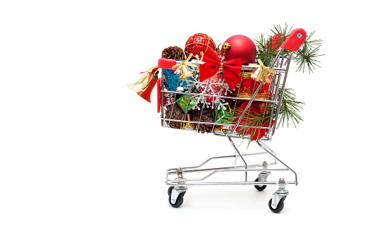 Christmas decoration gift in shopping cart isolated on white background