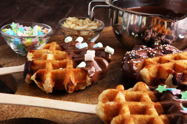istock Belgium waffles with chocolate sauce. popsicles with chocolate and wafer 861313818