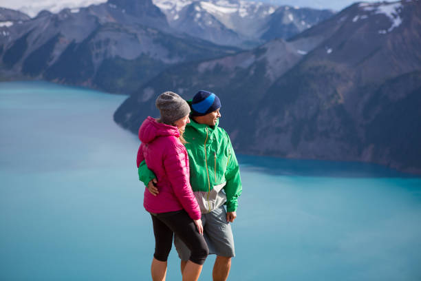 istock Couple embracing nature and the view 861314624