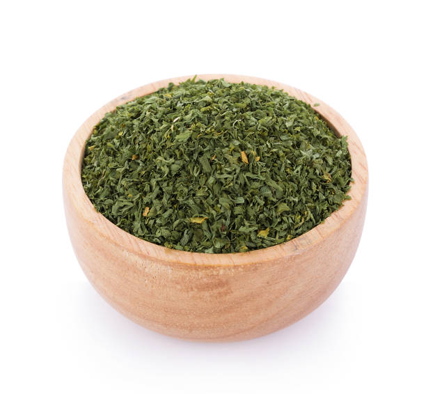 istock dried parsley in bowl isolated on white background 861315214