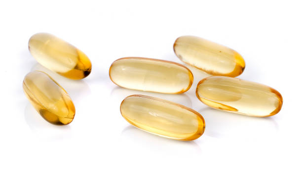 istock Fish oil pill on white background 861318378