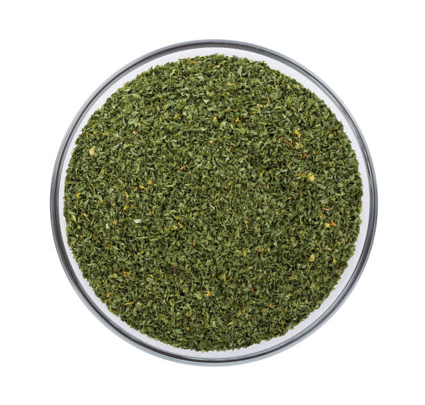 istock dried parsley in bowl isolated on white background 861318416