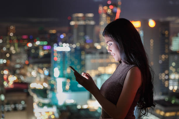 istock Women On Mobile With City View 861322430