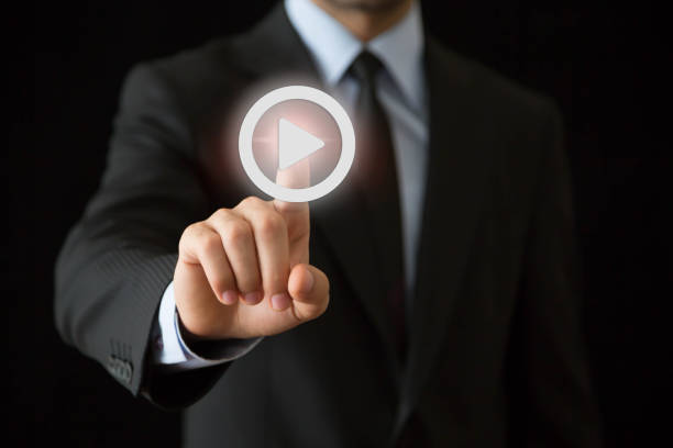 istock Businessman pressing play button to start 861325374
