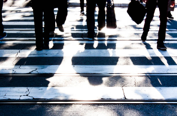 istock Blurry zebra crossing with  pedestrians walking shadows 861325418