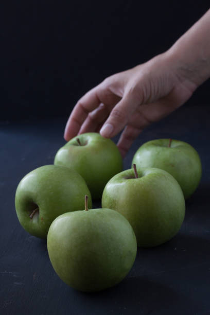 istock Green fresh apples on a black background 861330138