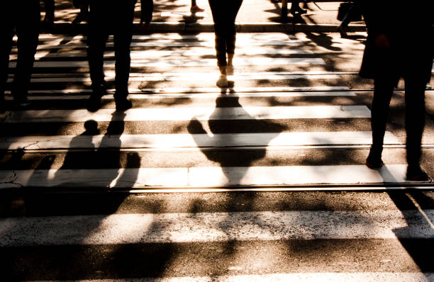 istock Blurry zebra crossing with  pedestrians walking shadows 861333198