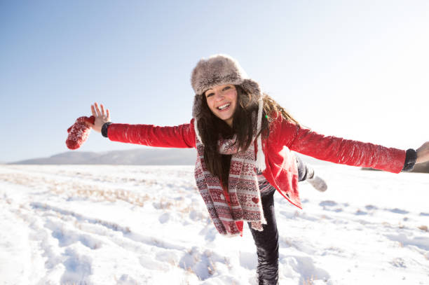 istock Beautiful young woman, having fun in the snow. 861336728