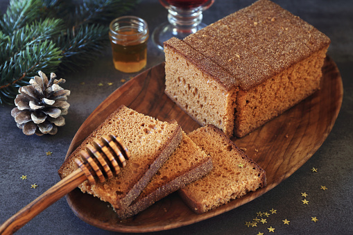 Christmas food: French spice bread and honey. Toned image