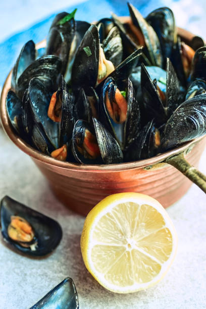 istock Mussels in copper bowl with lemon 861348652