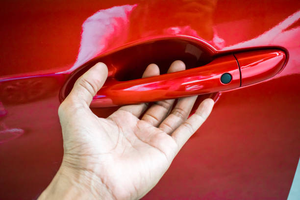 istock Car door handle red color for customers. Using wallpaper or background for transport and automotive image. 861352756
