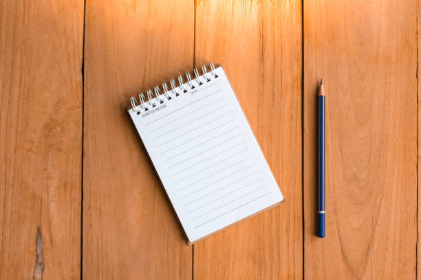 istock Notepad with pencil on wood board background.using wallpaper for education, business photo.Take note of the product for book with paper and concept, object or copy space. 861353018