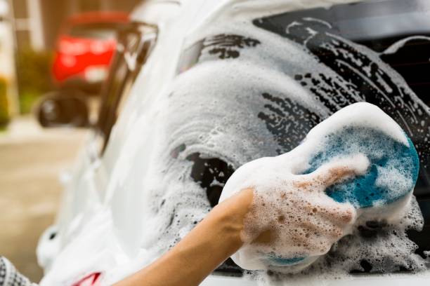 istock Hands hold with blue sponge washing car. Concept car wash clean. 861353162
