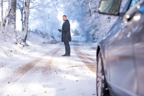 istock Man standing on a snowy road 861356530