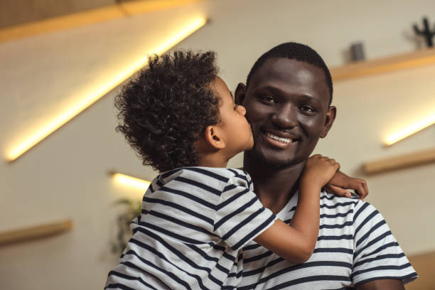 istock african american father and child hugging 861357408
