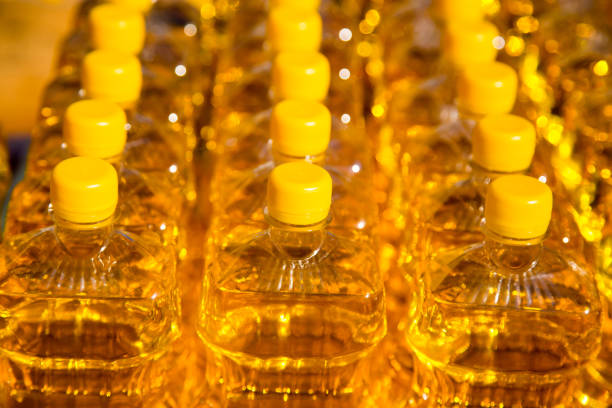 istock yellow vegetable oil in plastic bottles as background 861360078