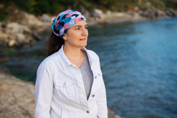 istock Woman standing at sunset with white denim 861360428