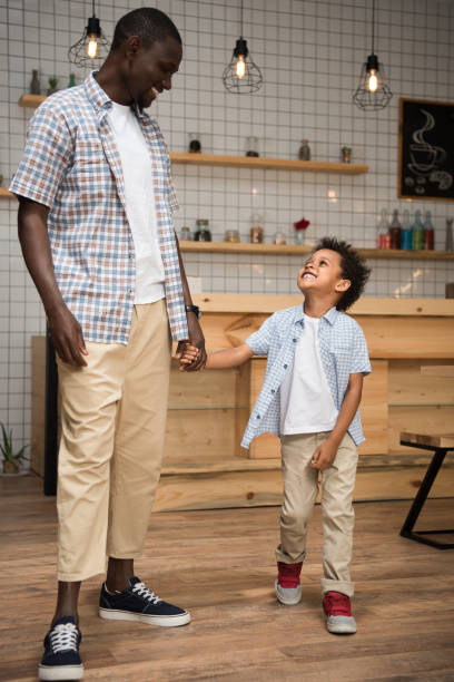 istock african american father and son holding hands 861360548