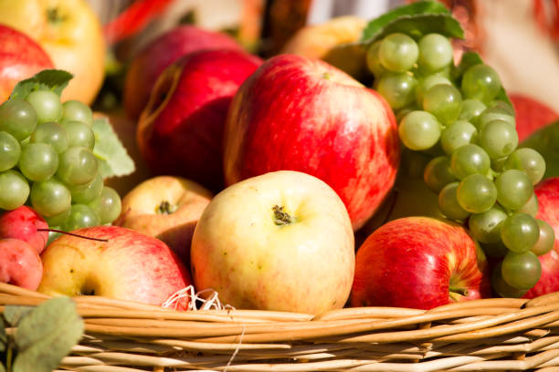 istock ripe apples with grapes in a basket 861361158