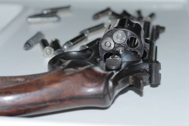 istock bullets in revolver gun 861361190