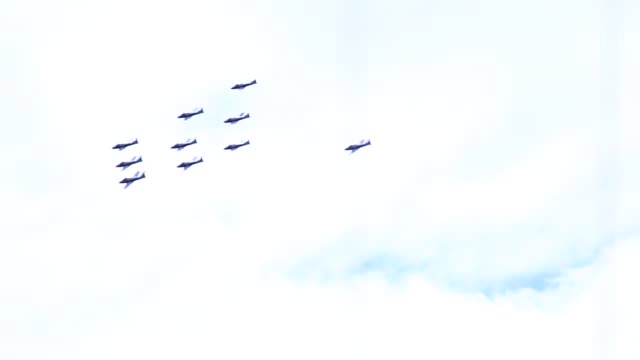 Video of aircraft doing close flybys of a marina in an airshow.