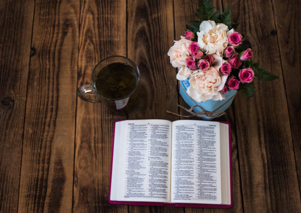 istock roses tea and bible on wooden 861364022