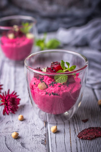 istock Homemade roasted beet hummus on a wooden background 861364318