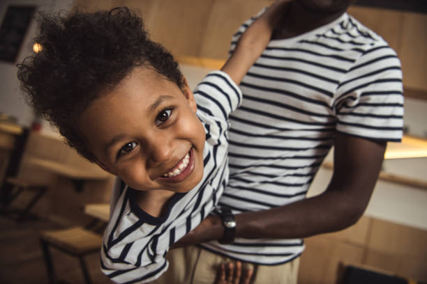 istock african american father carrying son 861364584