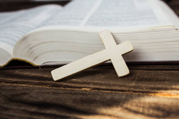 istock bible and cross on wooden background 861369228