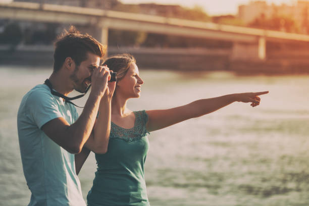 istock Happy couple photographing 861369424