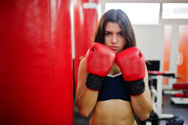 istock Young beautiful woman doing exercises  and working hard in gym and enjoying her training process. 861372518