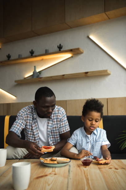 istock father and son eatong toasts 861375846