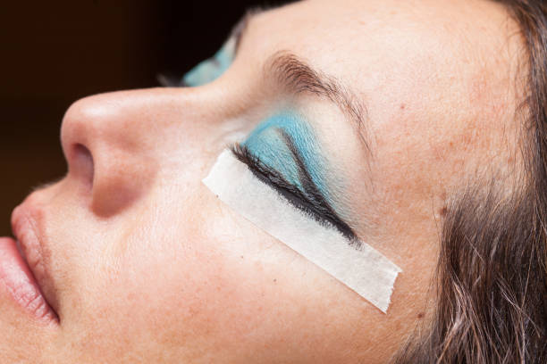 istock Woman while make up artist creates cat eyes 861375994