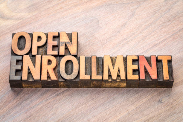 istock open enrollment word abstract in wood type 861377314